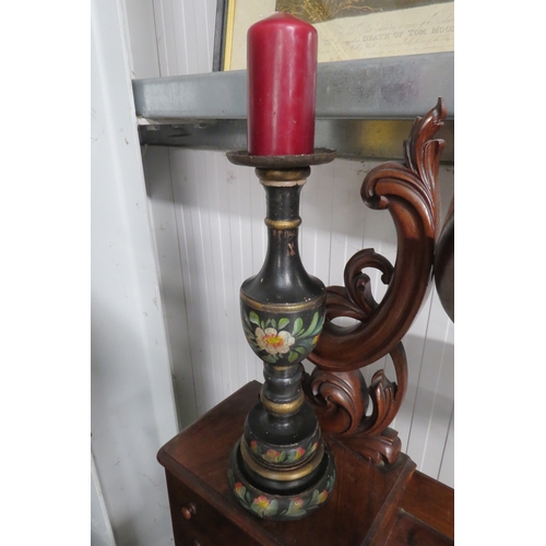 2170 - A cast iron candlestick and a painted wooden candlestick   (R) £25