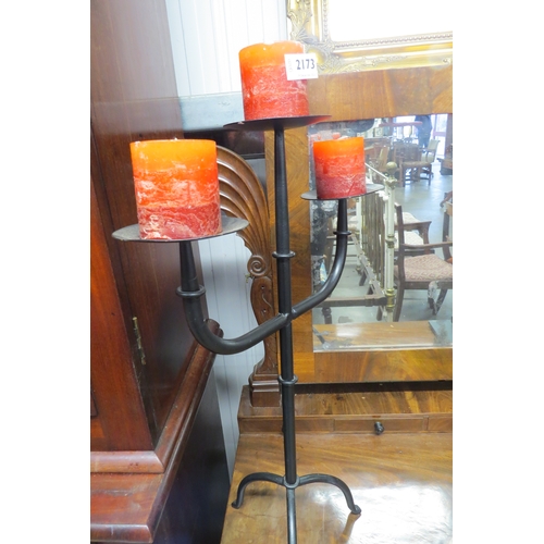 2173 - A cast iron three arm candle stand   (R) £20