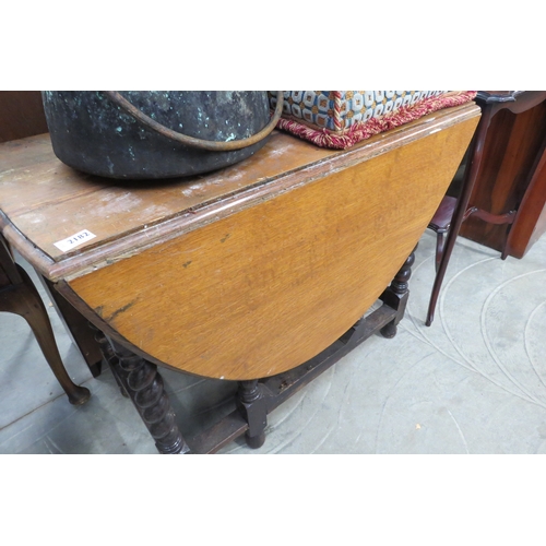 2182 - An oak drop-leaf table with barley twist legs