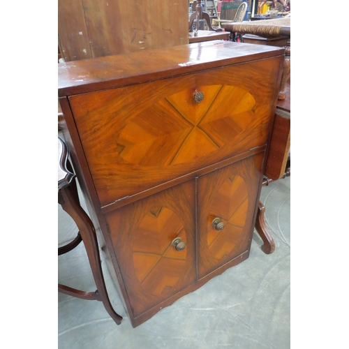 2187 - A 1950's walnut cocktail cabinet