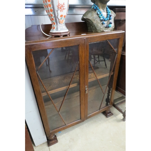 2224 - A 1940's oak and glazed display cabinet