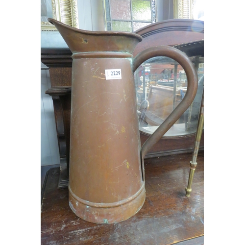 2229 - A large copper jug and an oak metal bound flagon