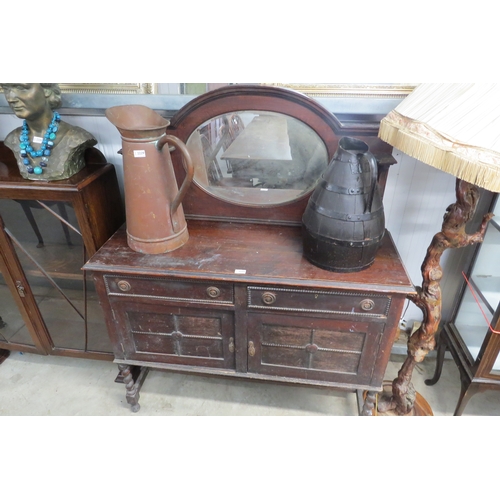 2231 - A 1930's oak two drawer two door sideboard