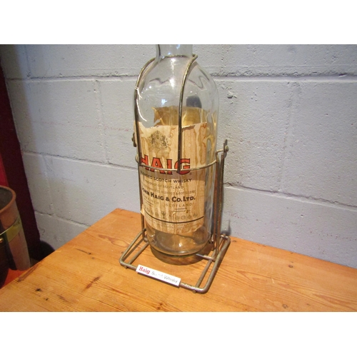 1435 - A large Haig Whisky advertising empty bottle and stand, 52cm tall     (R) £20