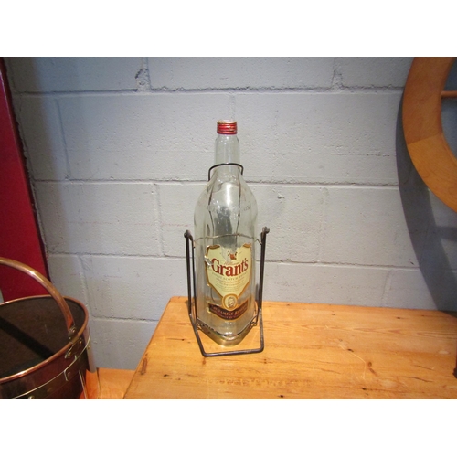 1442 - A large Grant's Whisky advertising empty bottle and stand, 50cm high     (R) £15