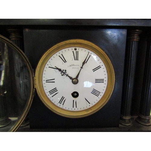 1447 - A late 19th Century black slate mantel clock, white enamel dial with Roman numerals