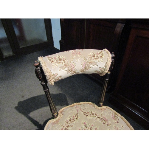 1101 - A Victorian nursery chair, ebonised turned back and legs raised on castors