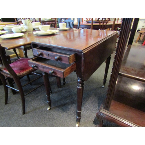 1137 - A 19th Century mahogany Sutherland table, two single drawers and two dummy drawers, raised on turned... 