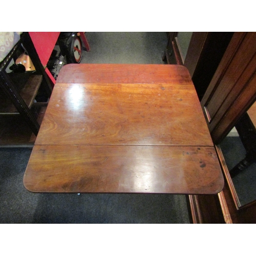 1137 - A 19th Century mahogany Sutherland table, two single drawers and two dummy drawers, raised on turned... 