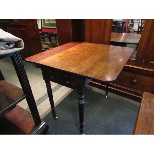 1137 - A 19th Century mahogany Sutherland table, two single drawers and two dummy drawers, raised on turned... 