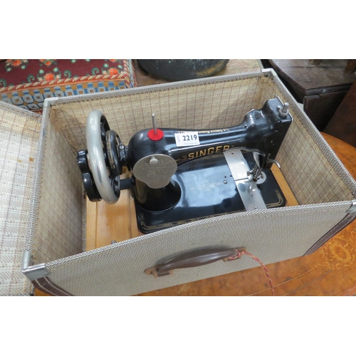 2219 - A cased hand driven sewing machine   (R) £10