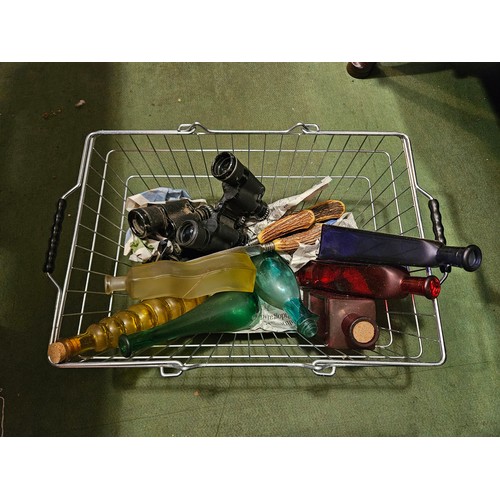 4041 - A mixed lot; glass bottles, binoculars, horn carving set, etc