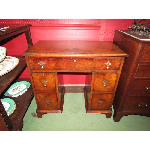 4076 - An early George III revival walnut twin pedestal desk of small proportions with five drawers over br... 