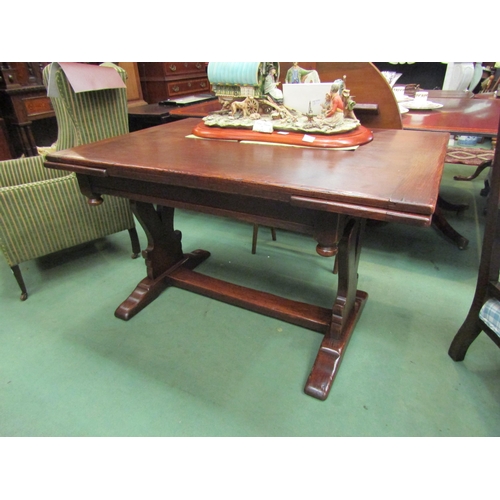 4083 - A 17th Century style oak draw-leaf extending dining table, the cleated end top over a fret trestle b... 