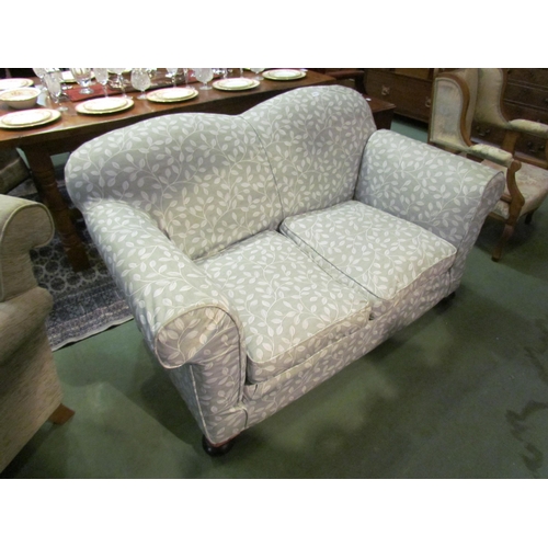 4183 - A late Victorian drop-end sofa with scroll arms over bun feet castors having removable 