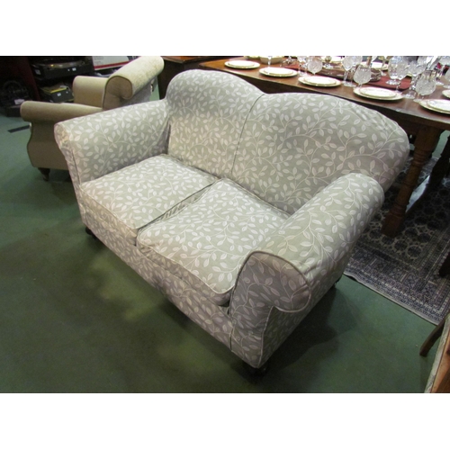 4183 - A late Victorian drop-end sofa with scroll arms over bun feet castors having removable 