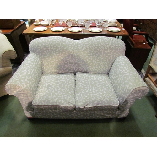 4183 - A late Victorian drop-end sofa with scroll arms over bun feet castors having removable 