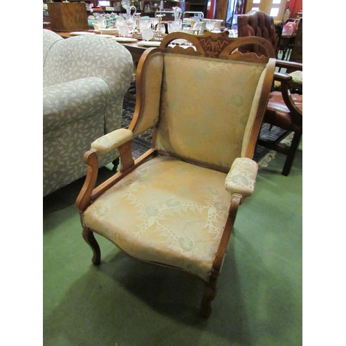 4186 - An Edwardian satin walnut inlaid open armchair with ivorine inlay and mixed wood decoration on cabri... 