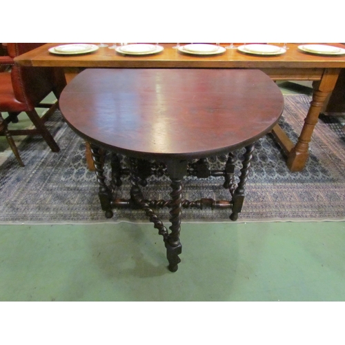 4193 - An Edwardian 17th Century revival oak oval top gate-leg table, the rising leaves over barley-twist l... 