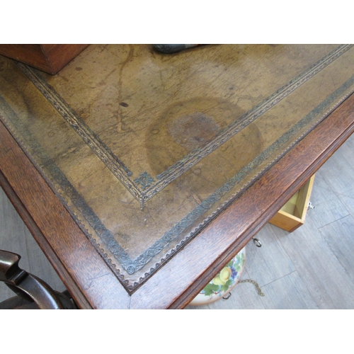 4123 - A George III revival mahogany library desk, the green tooled leather writing insert over three friez... 