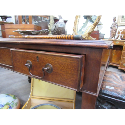 4123 - A George III revival mahogany library desk, the green tooled leather writing insert over three friez... 