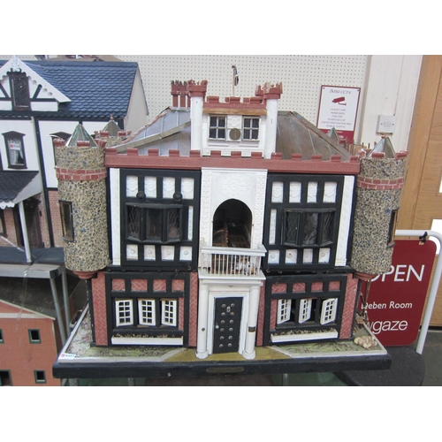 2319 - 'Glen Reckie House' a large fully furnished dolls house with castellated roof, turrets and wooden sc... 