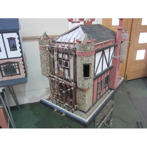 2319 - 'Glen Reckie House' a large fully furnished dolls house with castellated roof, turrets and wooden sc... 