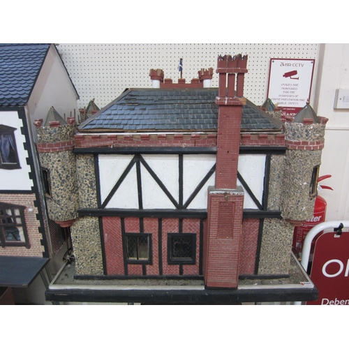 2319 - 'Glen Reckie House' a large fully furnished dolls house with castellated roof, turrets and wooden sc... 