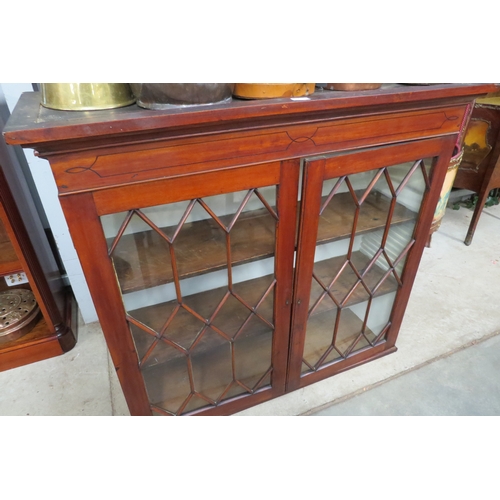 2097 - A Georgian mahogany and glazed cabinet with shelved interior