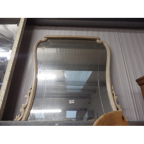 2218 - A framed overmantel shaped mirror 95 x 93cm