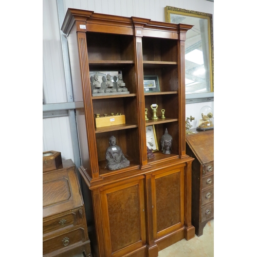 2076 - A Georgian style twin shelved bookcase over double cupboard base