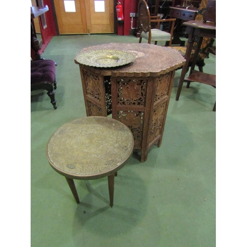 4009 - An Indian brass-top coffee table together with a repoussé charger and an Indian carved hardwood coff... 