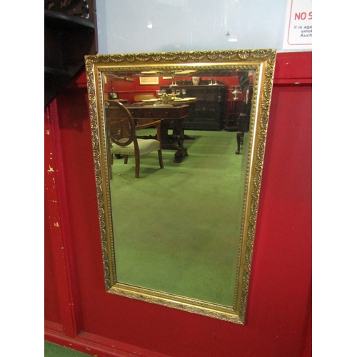 4026 - A gilt framed bevel edged wall mirror. Mirror plate 67.5cm x 39.5cm