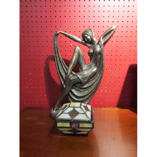 4029 - An Art Deco style metallic resin figurine of a semi-clad female, 33cm tall, together with a Tiffany ... 