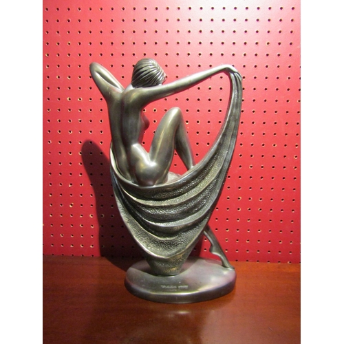 4029 - An Art Deco style metallic resin figurine of a semi-clad female, 33cm tall, together with a Tiffany ... 