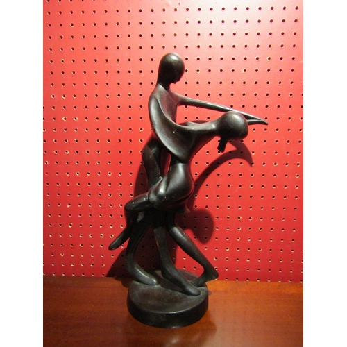 4031 - An abstract bronzed resin sculpture of dancing couple, 35.5cm tall