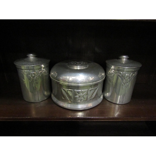 4036 - Three N.C.J. Ltd. metal containers, embossed Arts & Crafts style design