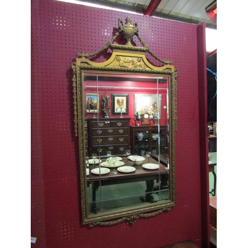 4073 - A Louis XVI style gilt framed wall mirror with urn and swag detail, 115cm x 61cm total