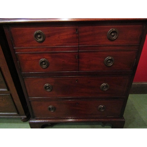 4096 - A George III crossbanded flame mahogany cabinet the two doors over two long drawers and bracket feet... 