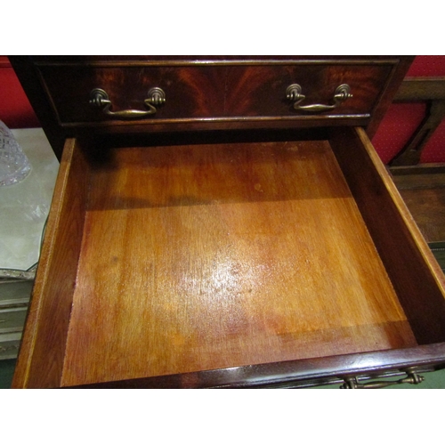 4109 - A George III style crossbanded flame mahogany tallboy of small proportions the hinged top over one f... 