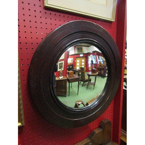 4113 - An early 19th Century oak circular frame convex wall mirror, 48cm diameter