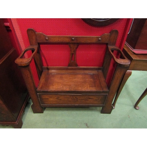 4114 - A 1940's oak monks bench in the Arts & Crafts style, 87cm tall x 91cm wide x 33cm deep