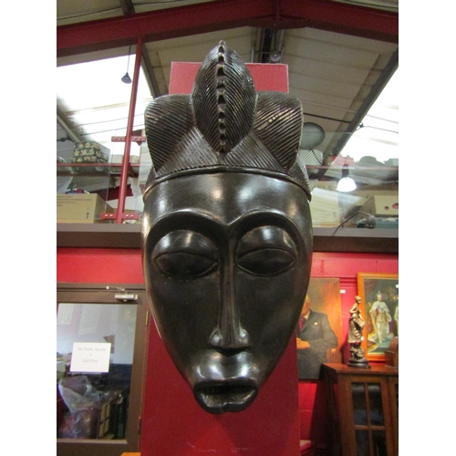 4115 - A hardwood African mask, possibly Ghanaian, 33cm tall