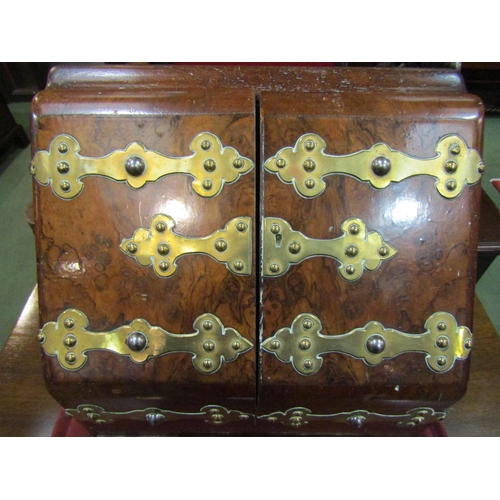 4116 - A burr walnut stationery box, hinged front opening bearing brass Gothic influence mounts, single dra... 