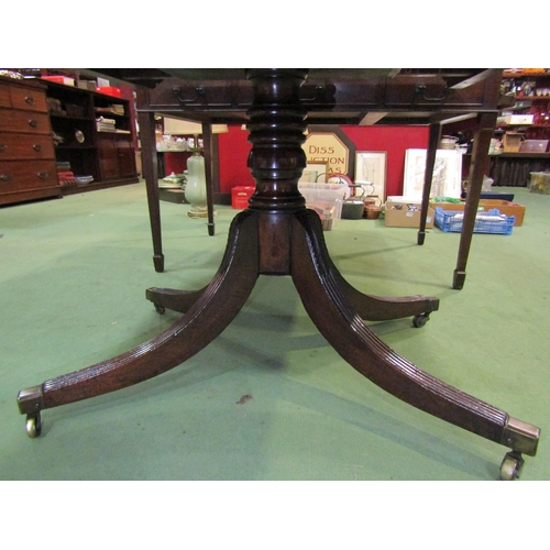 4122 - A Circa 1840 flame mahogany reeded edge cornered tilt-top table on a turned column and carved acanth... 