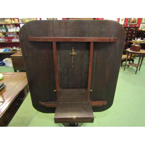 4122 - A Circa 1840 flame mahogany reeded edge cornered tilt-top table on a turned column and carved acanth... 