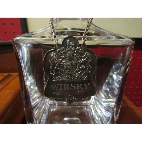 4132 - A boxed Garrard silver collared decanter and Queen's Silver Jubilee whisky label together with four ... 