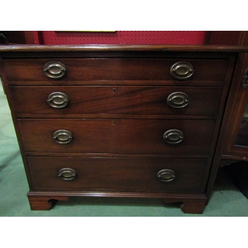 4133 - A Georgian flame mahogany chest of small proportions, the four graduating long drawers with oval bac... 