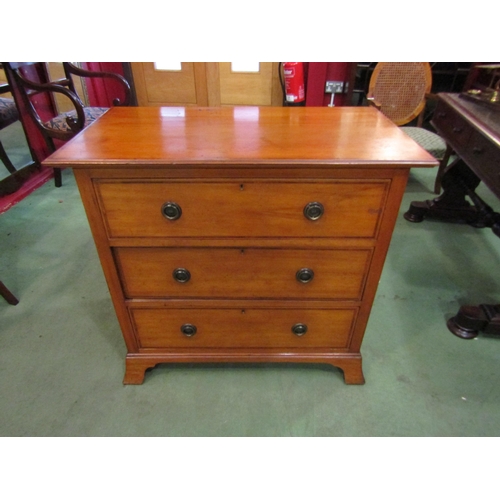 4191 - A 'Harris & Lebus of London' Edwardian Arts & Crafts crossbanded satinwood chest of three long drawe... 