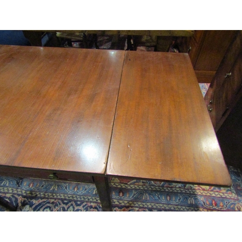 4199 - A Georgian mahogany lamp table with drop-flaps, single drawer, chamfered legs to castors, 73cm x 61c... 